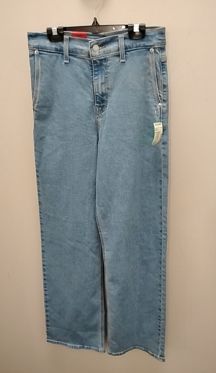 Size 0 Levi Jeans hanging on display, showcasing classic blue denim style from Clothesline Consignment.