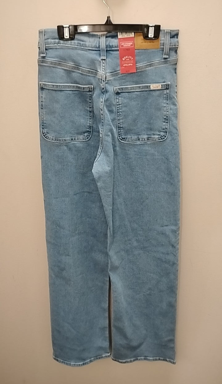 Back view of Size 0 Levi Jeans hanging on a hanger, showcasing the classic pocket design.