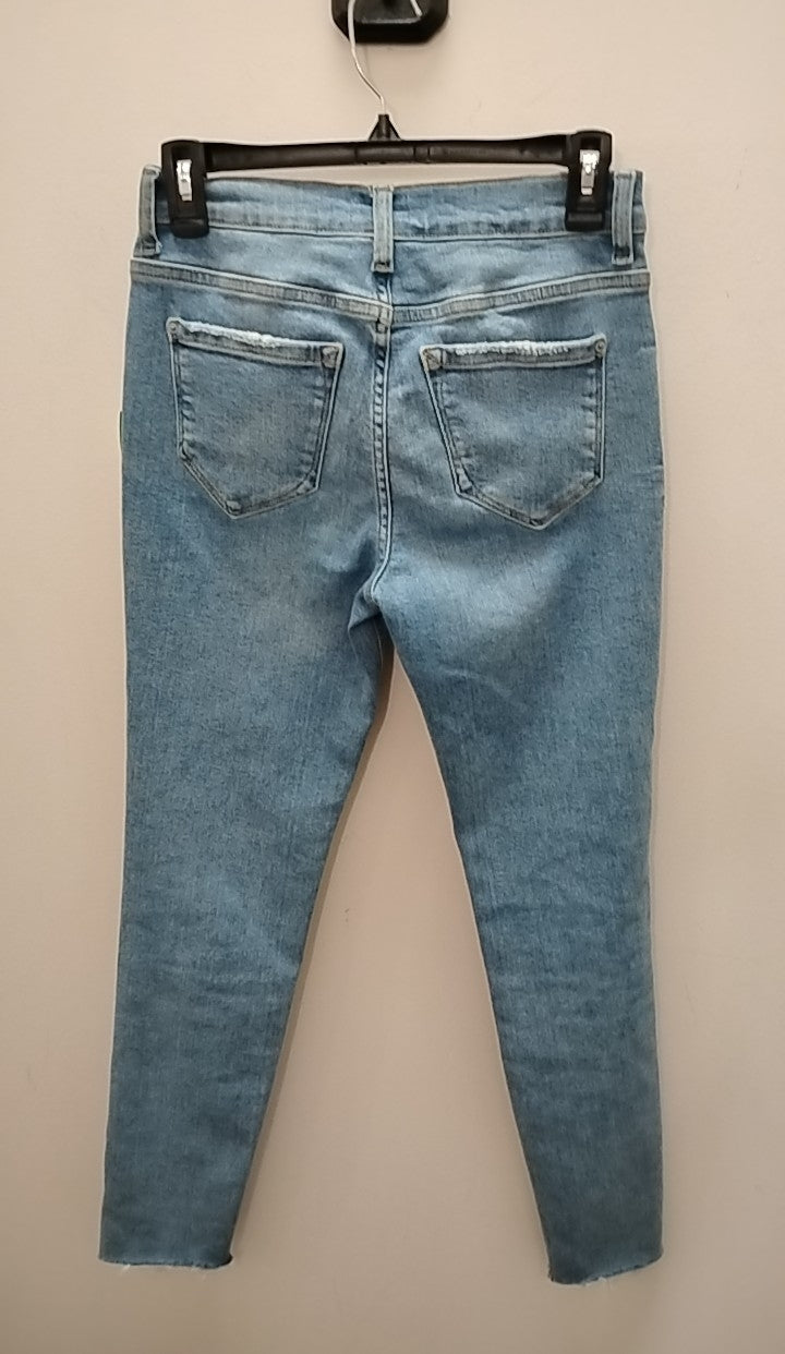 Back view of Size 2 Kensie Jeans showcased in a light blue wash at Clothesline Consignment.